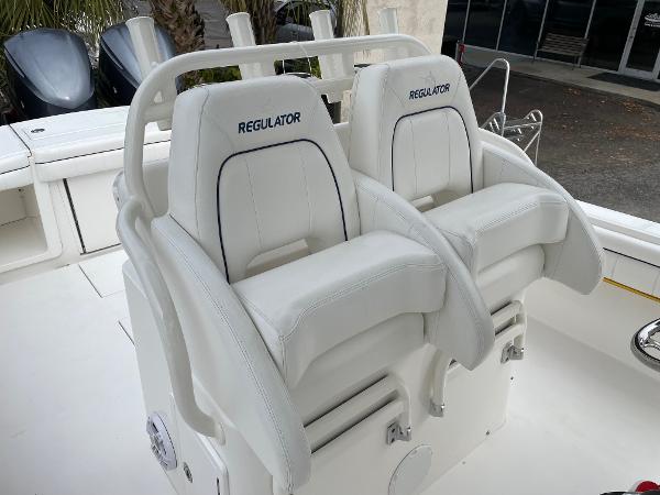 Slide: The Image of 2016 Regulator 34SS boat seats, white leather, dual helm chairs. - 28