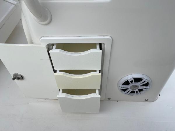 Slide: The Image of 2016 Regulator 34SS boat storage drawers and speaker detail. - 33