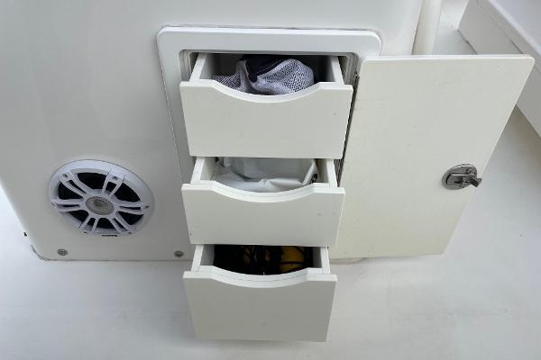 Slide: The Image of Storage drawers and speaker on 2016 Regulator 34SS boat. - 34