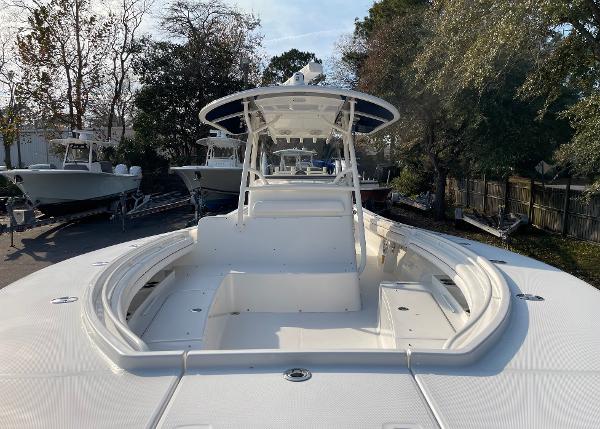 Slide: The Image of 2016 Regulator 34SS boat with spacious deck and sleek design, docked outdoors. - 35