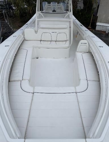 Slide: The Image of 2016 Regulator 34SS boat with spacious white seating and sleek design. - 41