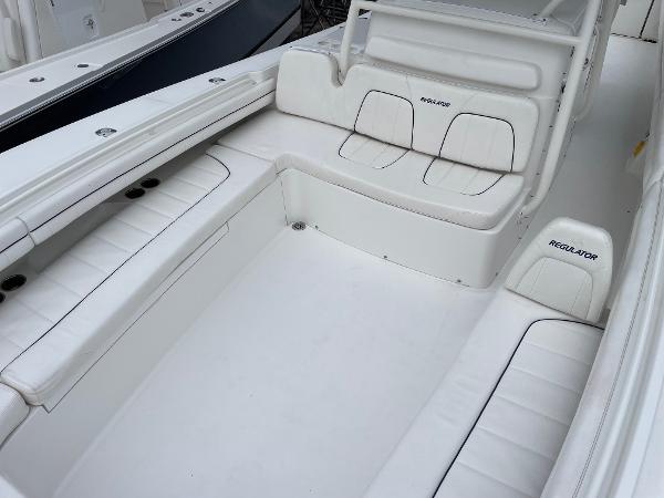 Slide: The Image of 2016 Regulator 34SS boat interior with white seating and spacious layout. - 43