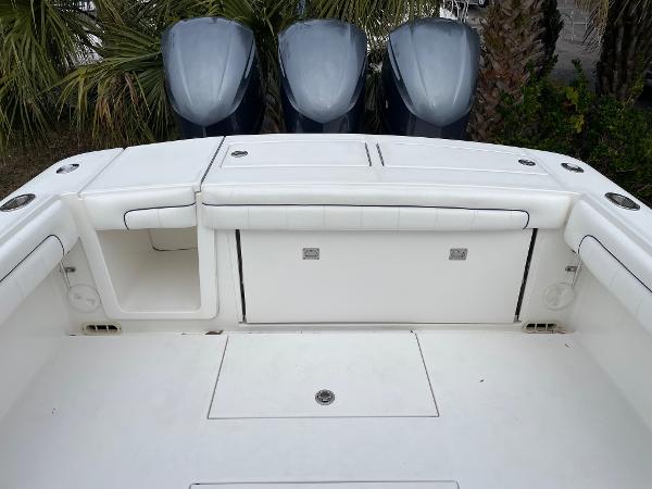 Slide: The Image of 2016 Regulator 34SS boat with triple outboard engines and spacious deck layout. - 49