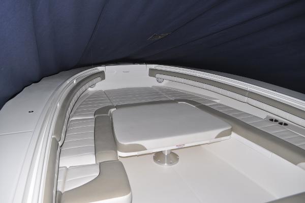 Slide: The Image of 2019 Regulator 34 SS boat interior with cushioned seating and table. - 18