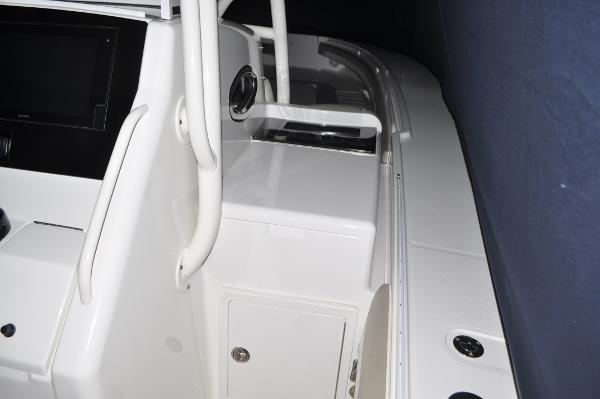 Slide: The Image of 2019 Regulator 34 SS boat interior console and storage compartment. - 20