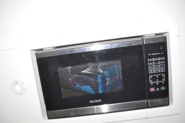 Slide: The Image of Built-in microwave oven in a 2019 Regulator 34 SS boat. - 26