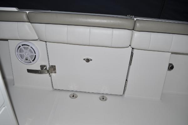 Slide: The Image of 2019 Regulator 34 SS boat interior with storage compartment and speaker. - 33