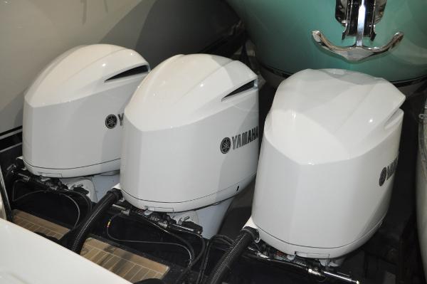 Slide: The Image of Triple Yamaha outboard engines on a 2019 Regulator 34 SS boat. - 4