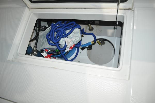 Slide: The Image of 2019 Regulator 34 SS storage compartment with blue rope and accessories. - 8