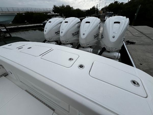 Slide: The Image of 2024 Regulator 41 boat with four powerful outboard engines docked. - 16