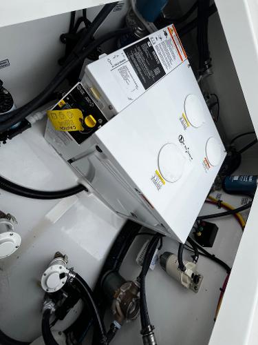 Slide: The Image of Electrical system components in the engine room of a 2024 Regulator 41 boat. - 20