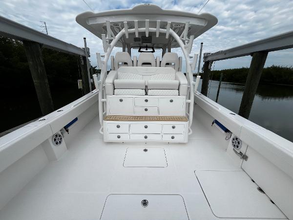 Slide: The Image of 2024 Regulator 41 boat interior with seating and storage compartments. - 21
