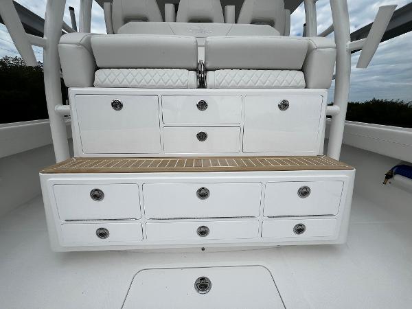 Slide: The Image of 2024 Regulator 41 boat storage compartments and seating area - 23
