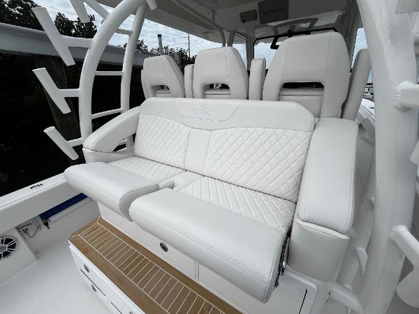 Slide: The Image of Luxurious seating on the 2024 Regulator 41 boat with white quilted upholstery. - 24