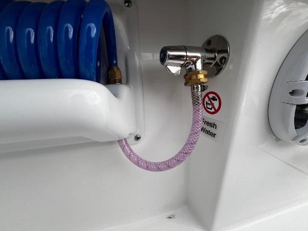 Slide: The Image of Freshwater hose connection on a 2024 Regulator 41 boat. - 32