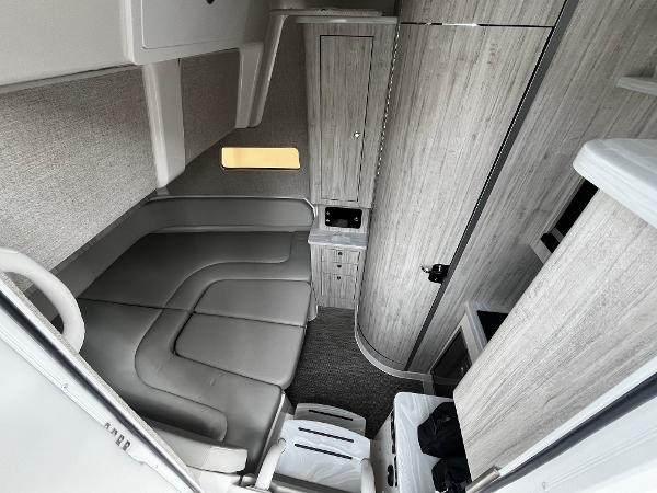 Slide: The Image of 2024 Regulator 41 boat interior with modern seating and wood paneling. - 36