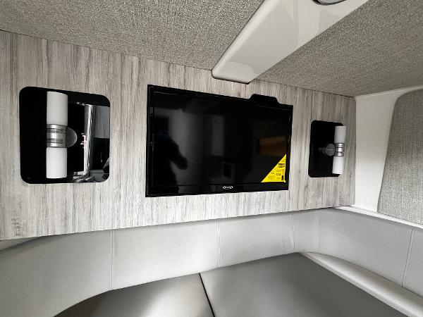 Slide: The Image of 2024 Regulator 41 cabin interior with TV and modern lighting. - 39