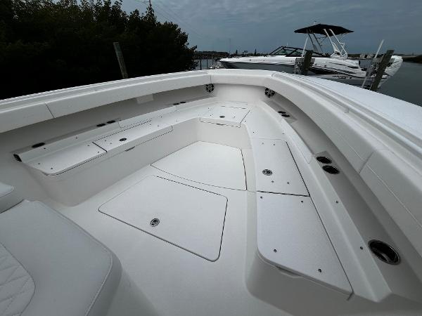 Slide: The Image of 2024 Regulator 41 boat with spacious seating and storage compartments. - 48