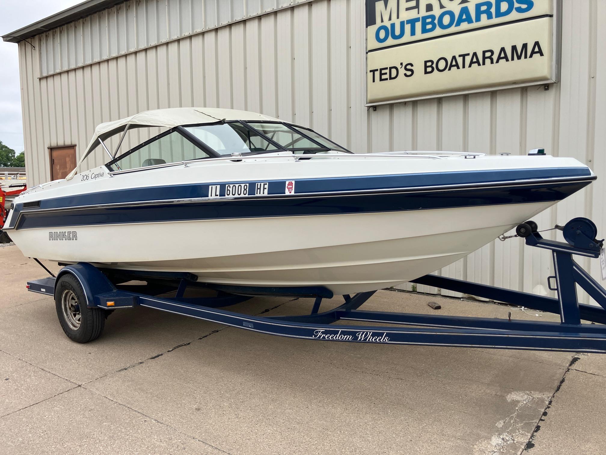 Slide: The Image of 1989 Rinker 206 Open Bow boat on trailer at Ted's Boatarama. - 0