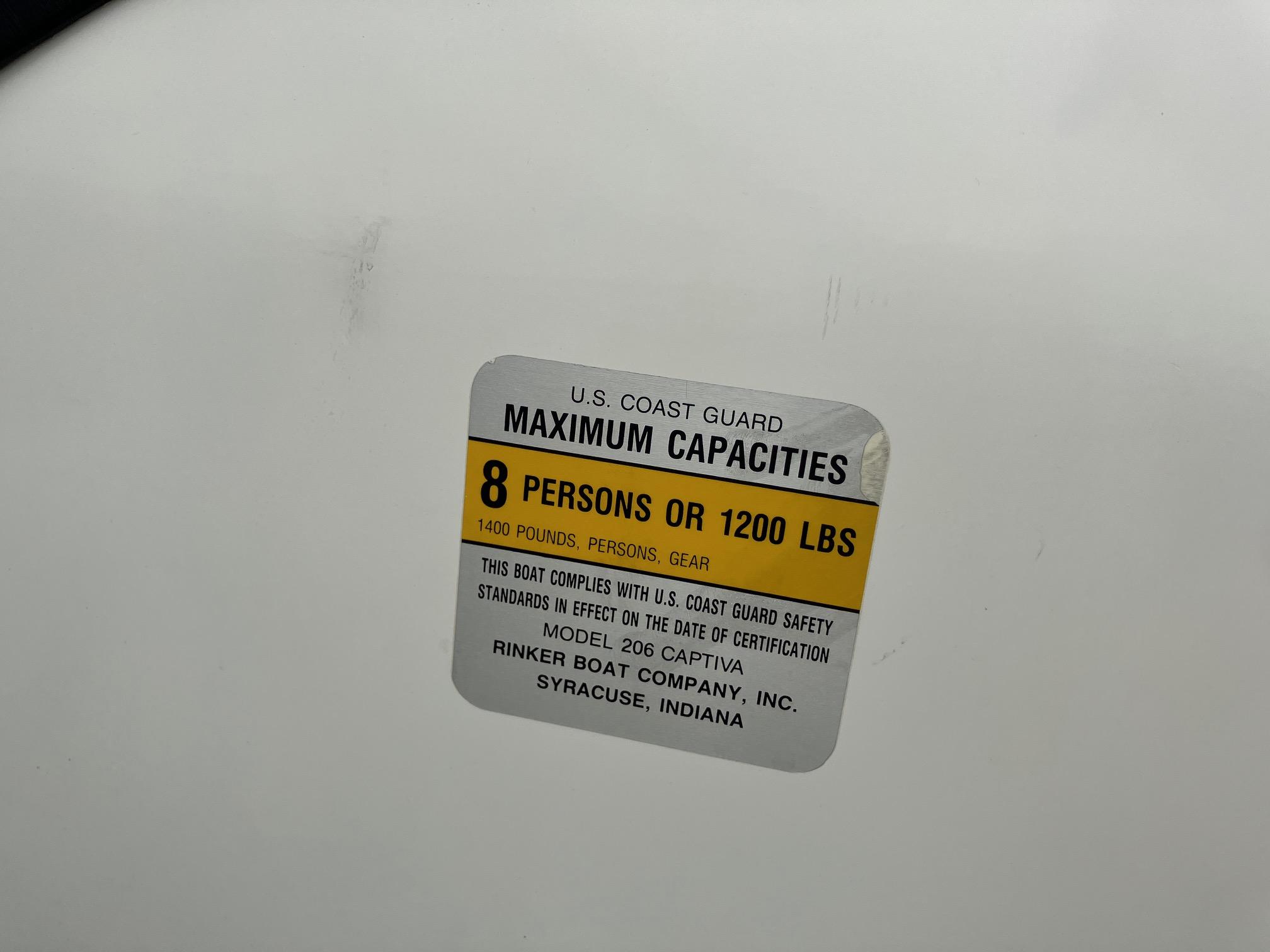 Slide: The Image of 1989 Rinker 206 Open Bow capacity label: 8 persons or 1200 lbs maximum. - 18