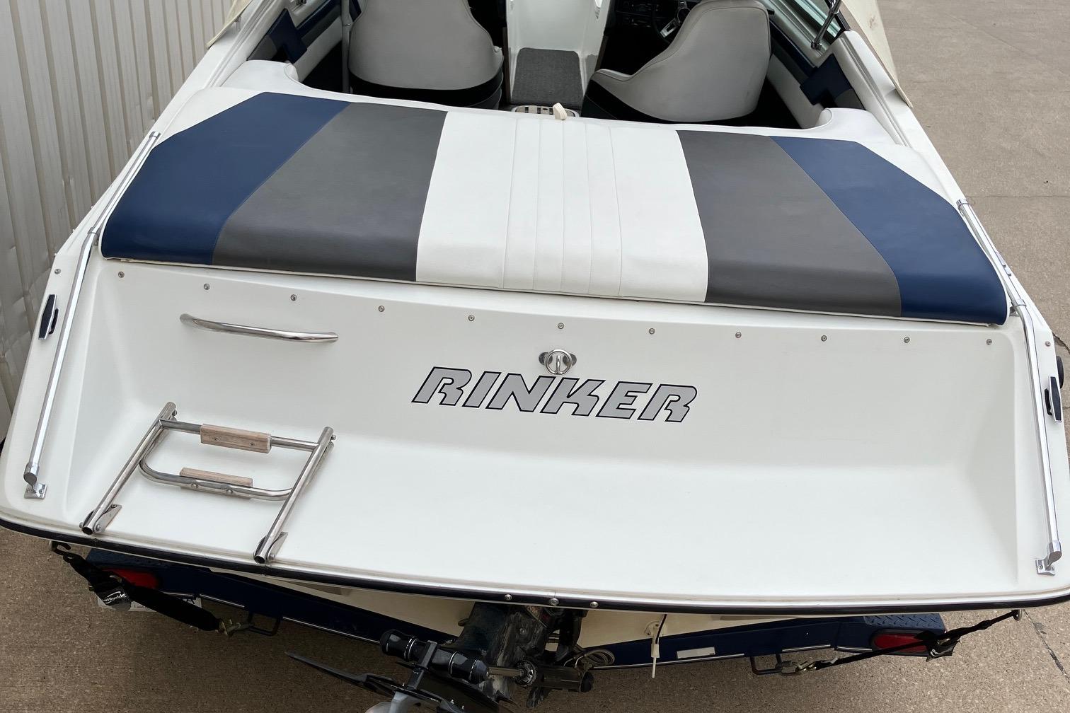 Slide: The Image of 1989 Rinker 206 Open Bow boat, rear view with swim platform and ladder. - 24