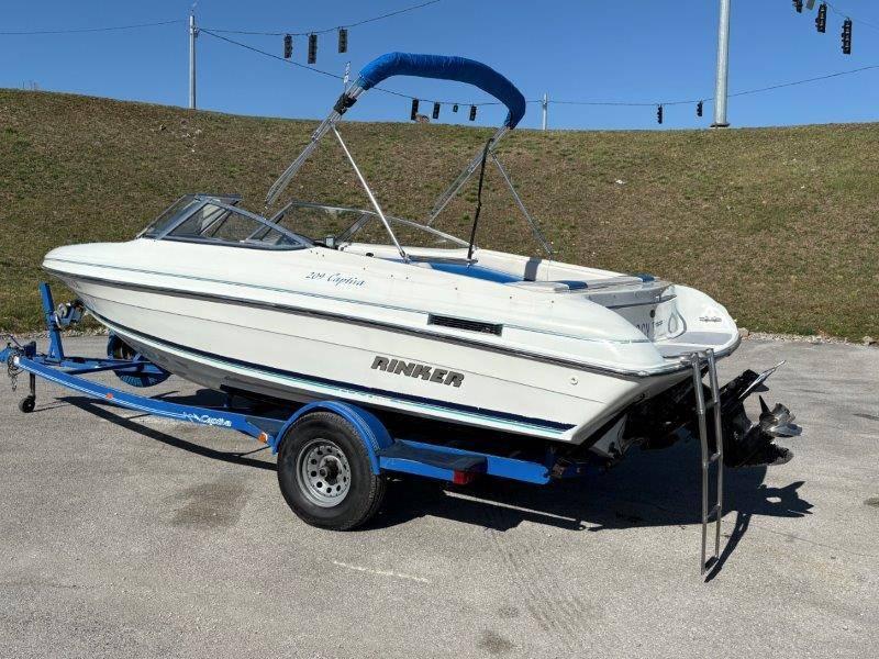 Slide: The Image of 1994 Rinker 209 Captiva boat on trailer, parked outdoors. - 2