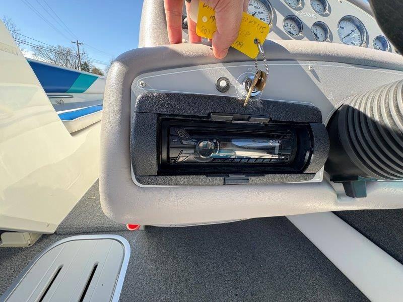 Slide: The Image of Dashboard of 1994 Rinker 209 Captiva boat with Sony stereo system and ignition keys. - 21