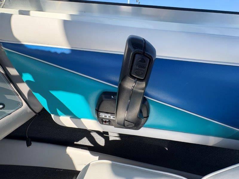 Slide: The Image of Interior view of a 1994 Rinker 209 Captiva boat throttle control. - 22