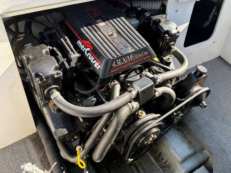 Slide: The Image of Engine of a 1994 Rinker 209 Captiva boat, featuring a MerCruiser 4.3L V6. - 30