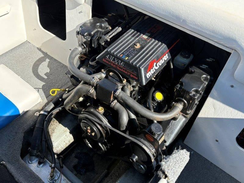Slide: The Image of Engine of a 1994 Rinker 209 Captiva boat, featuring a MerCruiser 4.3L V6. - 34