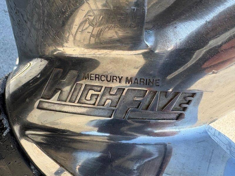 Slide: The Image of Close-up of Mercury Marine HighFive propeller on a 1994 Rinker 209 Captiva boat. - 35