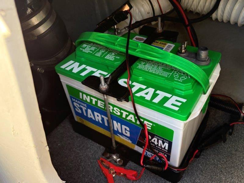 Slide: The Image of Interstate marine starting battery in 1994 Rinker 209 Captiva boat compartment. - 40