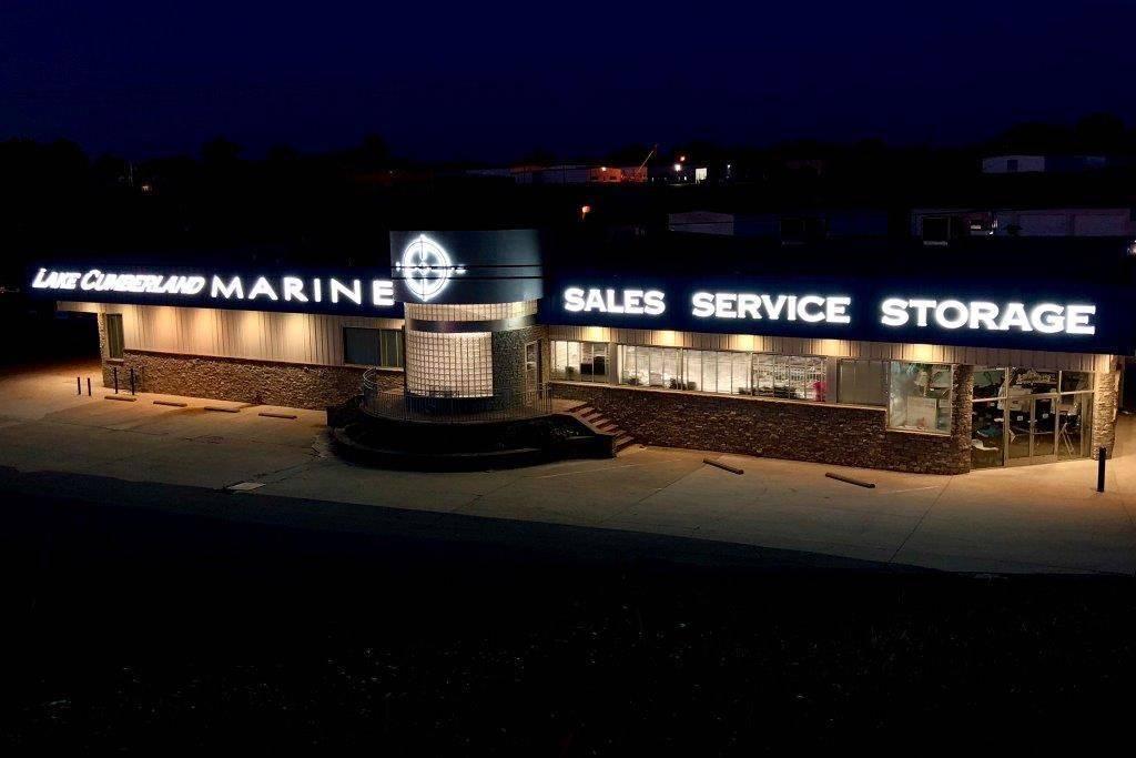 Slide: The Image of Lake Cumberland Marine building at night, offering sales, service, and storage for boats. - 41