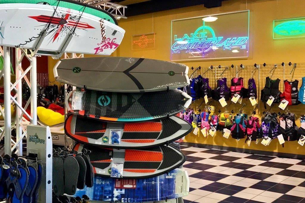 Slide: The Image of Water sports store with surfboards, life vests, and Lake Cumberland Marine sign. - 43