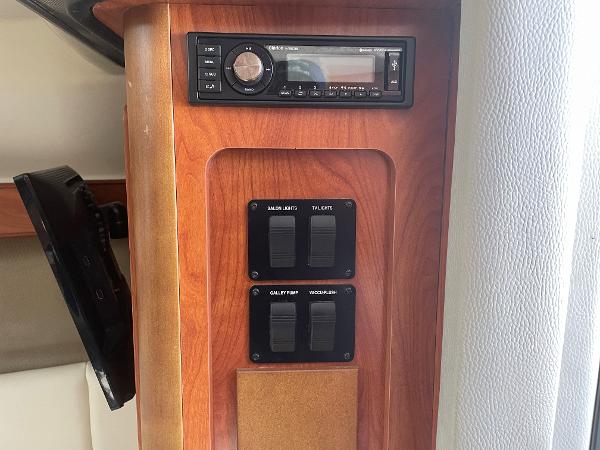Slide: The Image of 2008 Rinker 260 Express Cruiser interior control panel with stereo system. - 11
