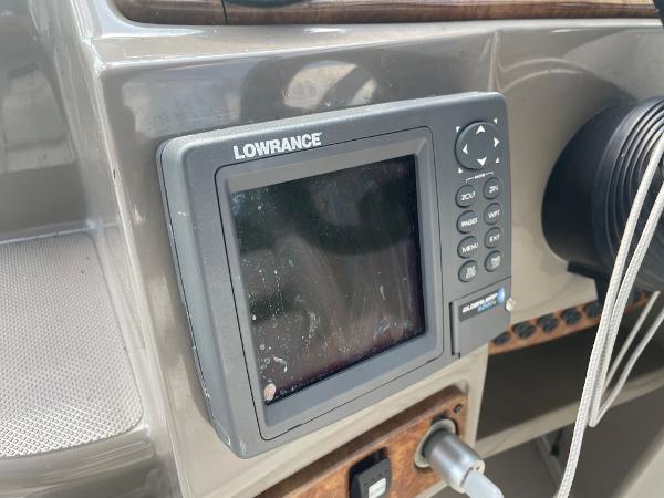 Slide: The Image of Lowrance marine GPS on 2008 Rinker 260 Express Cruiser dashboard. - 20