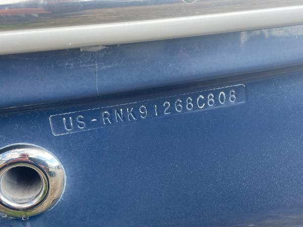 Slide: The Image of 2008 Rinker 260 Express Cruiser hull identification number on blue surface. - 3