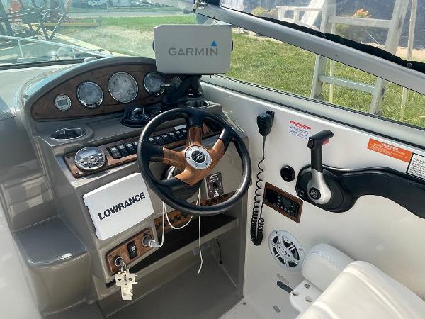 Slide: The Image of 2008 Rinker 260 Express Cruiser helm with Garmin and Lowrance navigation systems. - 6