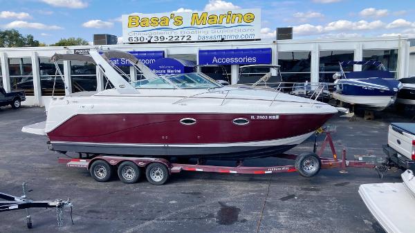 Slide: The Image of 2007 Rinker 270 Express Cruiser on trailer at Basa's Marine dealership. - 0