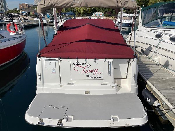 Slide: The Image of 2007 Rinker 270 Express Cruiser docked with maroon cover, Chicago, Illinois. - 1