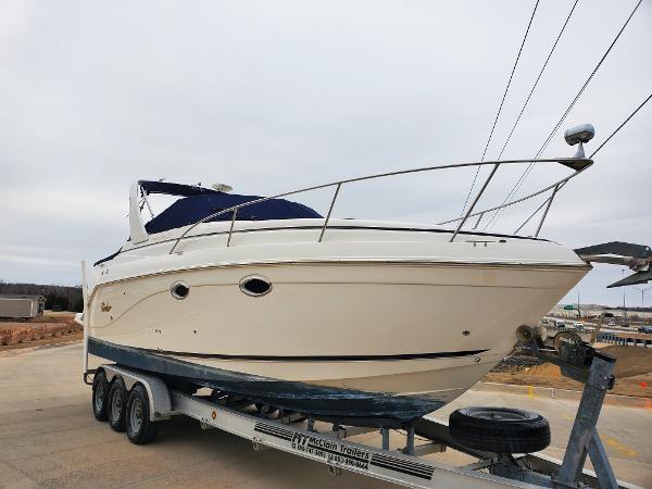 Slide: The Image of 2003 Rinker 270 Fiesta Vee Cr boat on trailer, side view. - 1
