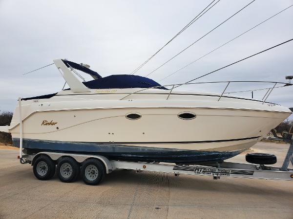 Slide: The Image of 2003 Rinker 270 Fiesta Vee Cr boat on trailer, side view. - 2
