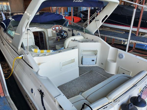 Slide: The Image of 2003 Rinker 270 Fiesta Vee Cr boat interior with seating and control panel. - 6