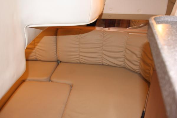 Slide: The Image of 2005 Rinker 312 Fiesta Vee cabin interior with beige leather seating. - 28