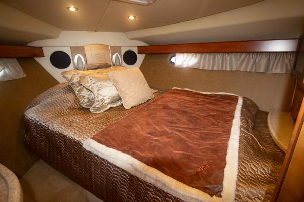 Slide: The Image of Luxurious bedroom in 2008 Rinker 400 Express Cruiser yacht with cozy bedding. - 15
