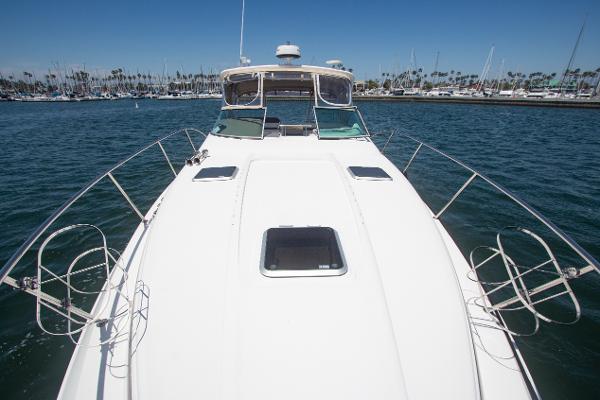 Slide: The Image of 2008 Rinker 400 Express Cruiser on water, front deck view. - 25