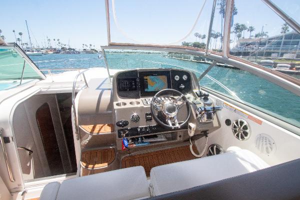 Slide: The Image of 2008 Rinker 400 Express Cruiser helm with navigation system and ocean view. - 4