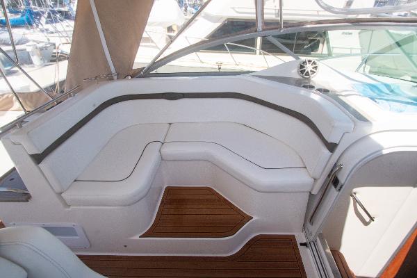 Slide: The Image of 2008 Rinker 400 Express Cruiser interior seating area with teak flooring. - 6