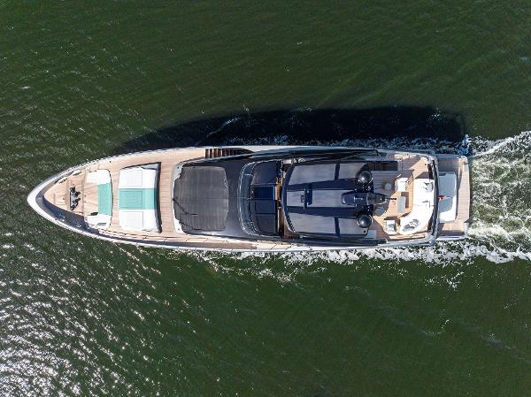 Slide: The Image of Aerial view of 2024 Riva 102 Corsaro Super yacht cruising on water. - 15