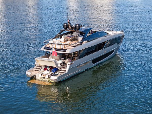 Slide: The Image of Luxurious 2024 Riva 102 Corsaro Super yacht cruising on calm waters. - 20